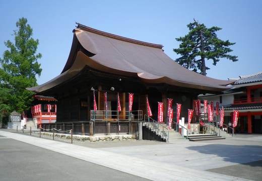 Fudo-do main hall of Kongoji Takahata Fudo temple with red banners