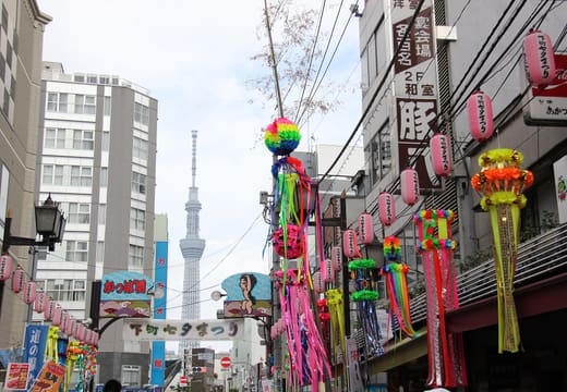 Shopping street decorated with tanabata streamers and lanterns, Tokyo Skytree visible in background