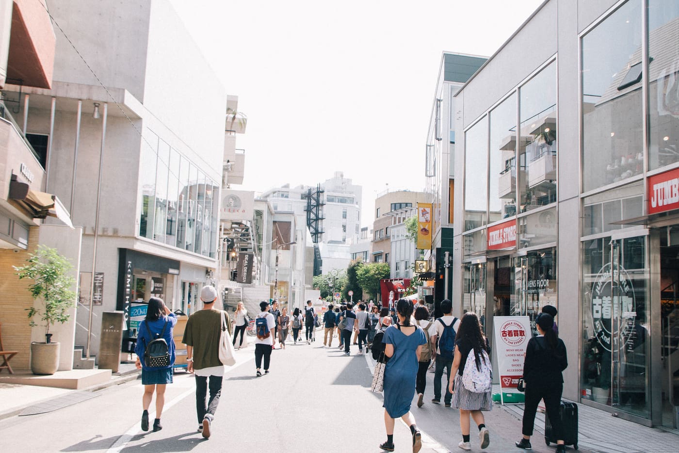Shoppers strolling past boutiques on Cat Street between Harajuku and Shibuya