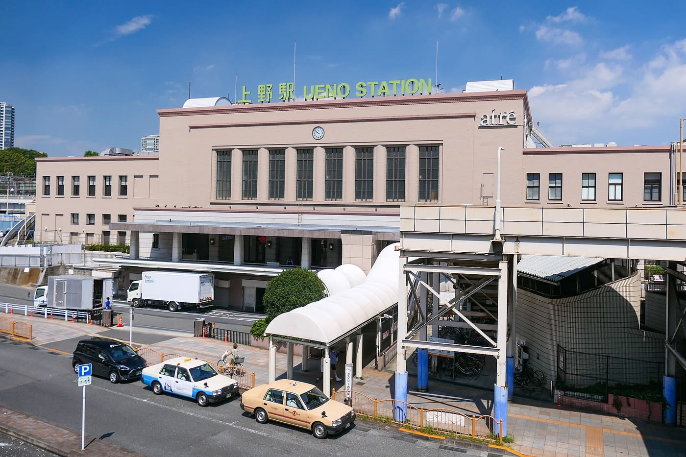 The historic main building of JR Ueno Station with taxis waiting out front