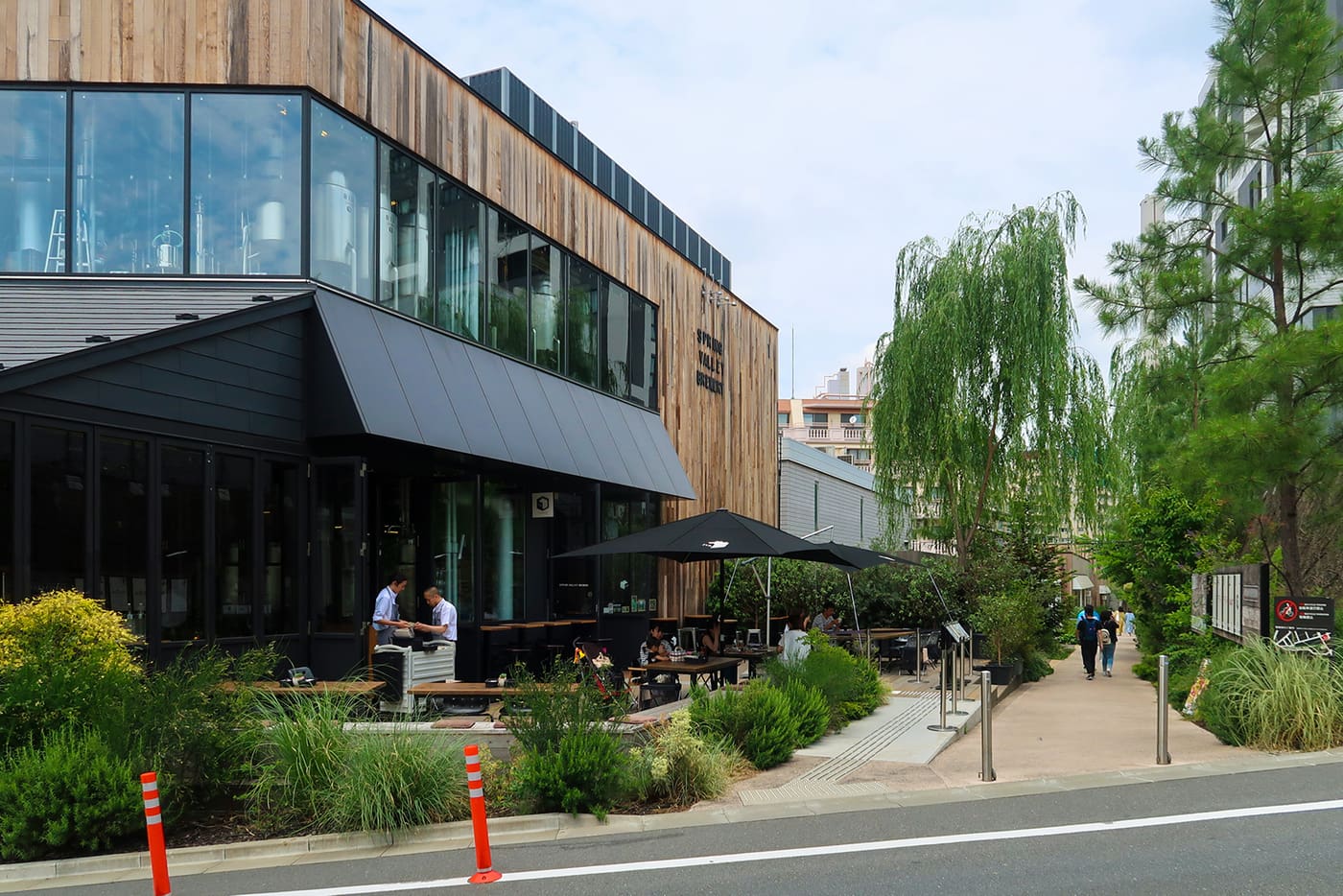 Log Road Daikanyama, the planted walkway of timber shops and a brewery on old railway land