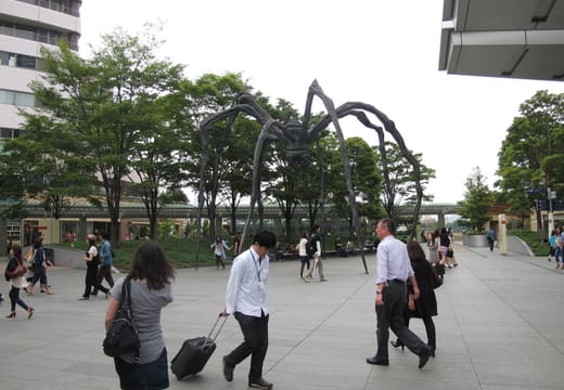 Louise Bourgeois spider sculpture Maman in the Roppongi Hills plaza with passers-by