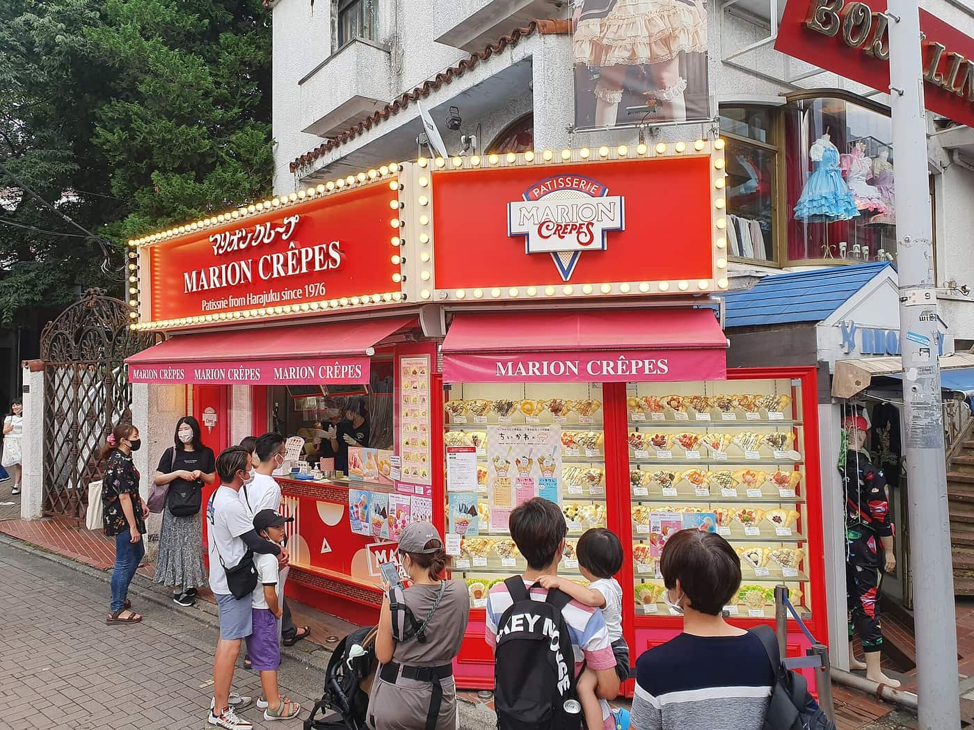 Marion Crepes stand on Takeshita Street with its wall of crepe models and queue