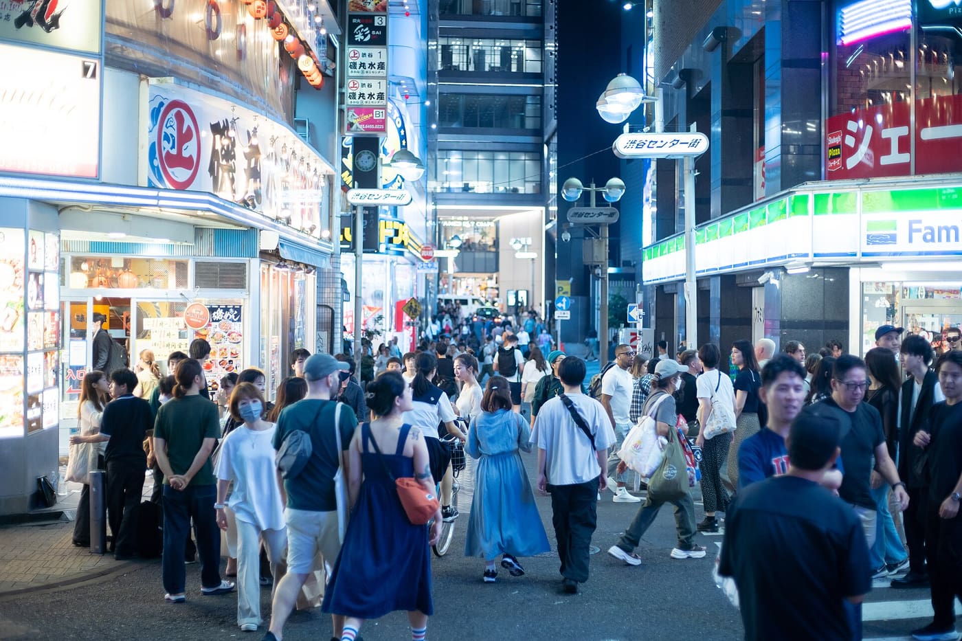 Evening crowds walking Center Gai, Shibuya's main street of shops and restaurants