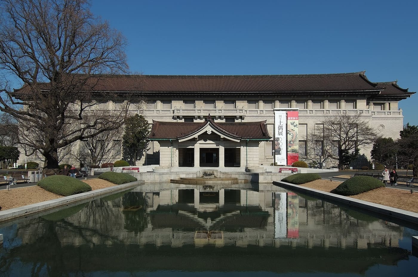Tokyo National Museum Honkan main building behind its fountain pool in Ueno Park