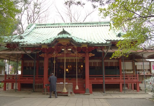 Red lacquered main hall of Akasaka Hikawa Shrine with its green copper roof