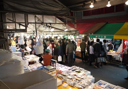 Shoppers crowding seafood stalls under the covered section of Ameyoko market in Ueno