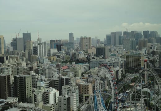 View from the Bunkyo Civic Center observation floor over Tokyo Dome City and central Tokyo