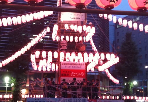 Lantern-hung yagura tower at the summer Bon Odori festival in front of Ebisu Station