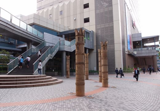 West exit plaza of Ebisu Station with its pedestrian deck and carved posts