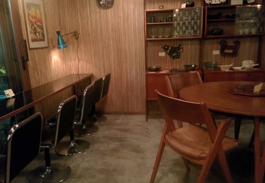 Vintage Norwegian chairs and wood-panelled interior of Fuglen Tokyo in Tomigaya