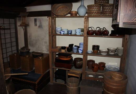 Recreated Edo-period kitchen with ceramics and baskets inside the Fukagawa Edo Museum