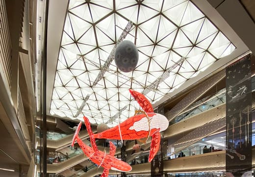 Central atrium of Ginza Six with a suspended art installation above the shopping floors