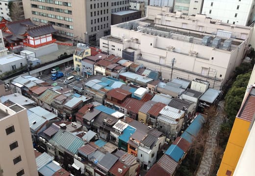 Tightly packed low rooftops of the Golden Gai bar district seen from above, Shinjuku