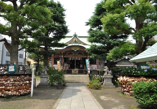 Stone approach lined with pines and ema racks leading to Imado Shrine