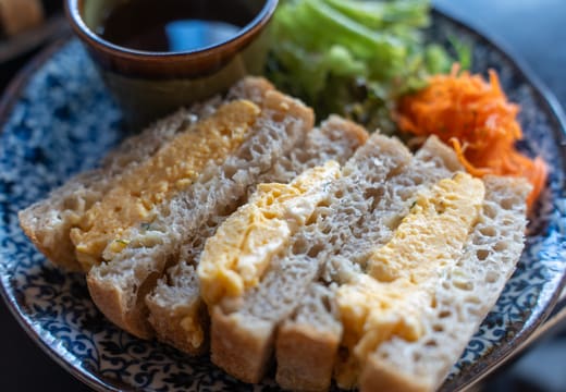 Kayaba Coffee's signature thick egg omelette sandwich served on a patterned plate