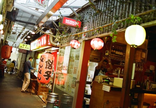 Red lanterns and small eateries along a narrow covered alley in Kichijoji