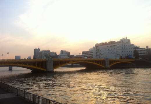 Kuramae Bridge silhouetted over the Sumida River at sunset