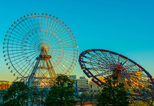 Cosmo Clock 21 Ferris wheel beside a smaller wheel at Yokohama Minato Mirai at dusk