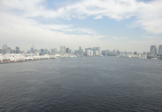 View across Tokyo Bay toward the city skyline from the Rainbow Bridge walkway