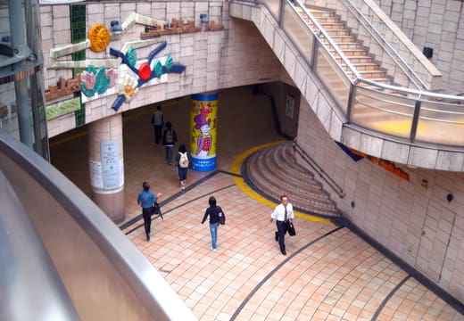 Patio plaza with sculptures and stairways at the foot of Carrot Tower, Sangenjaya