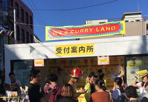 Visitors at the Curry Land information stand during the Shimokitazawa Curry Festival