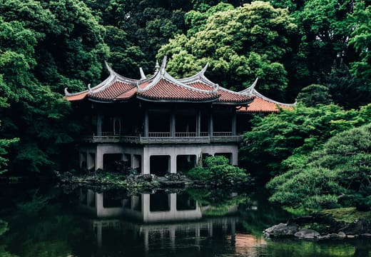 Taiwan Pavilion reflected in the pond of the Japanese garden at Shinjuku Gyoen