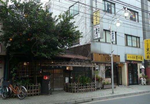 Vine-covered wooden street front of Sometaro okonomiyaki restaurant in Asakusa