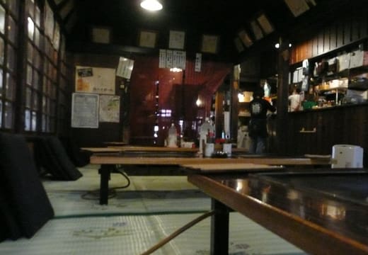 Low tables with built-in teppan griddles in the old tatami dining room of Sometaro, Asakusa