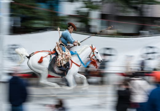 Mounted archer in costume galloping during the Yabusame festival at Sumida Park, Asakusa