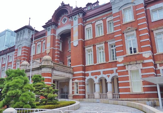 Close view of the red brick and white stone facade of Tokyo Station Marunouchi building