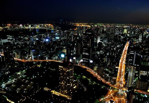 Rainbow Bridge and Tokyo Bay lights at night seen from the Tokyo Tower observatory