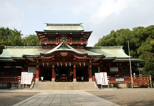 Ornate red and green main hall of Tomioka Hachimangu Shrine in Monzen-Nakacho