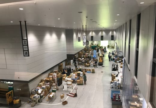 Traders and styrofoam boxes along the intermediate wholesale aisle of Toyosu Market