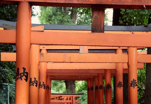Tunnel of red torii at Hanazono Inari Shrine inside Ueno Park