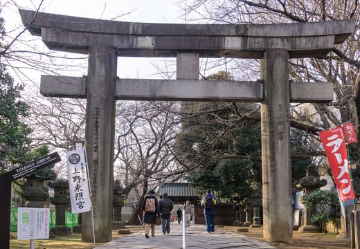 Stone torii at the start of the lantern-lined approach to Ueno Toshogu Shrine