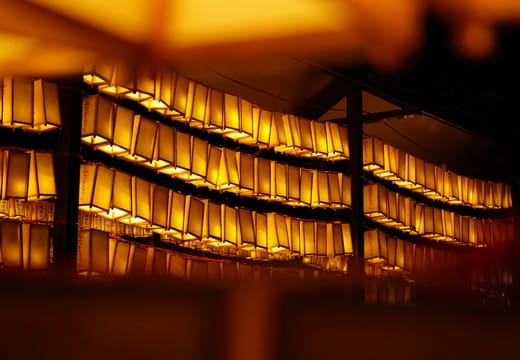 Walls of glowing paper lanterns during the summer Mitama Matsuri at Yasukuni Shrine