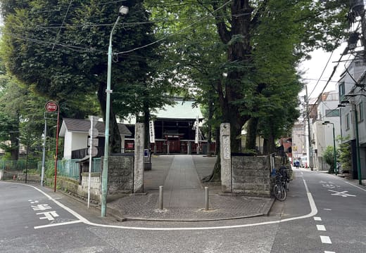Tree-lined west entrance and stone approach to Zoshigaya Kishimojin temple in Ikebukuro