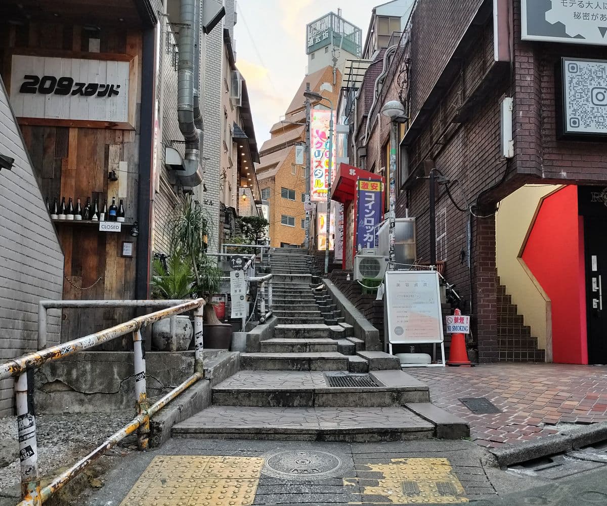 Stone steps climbing a quiet back lane off Dogenzaka in Shibuya