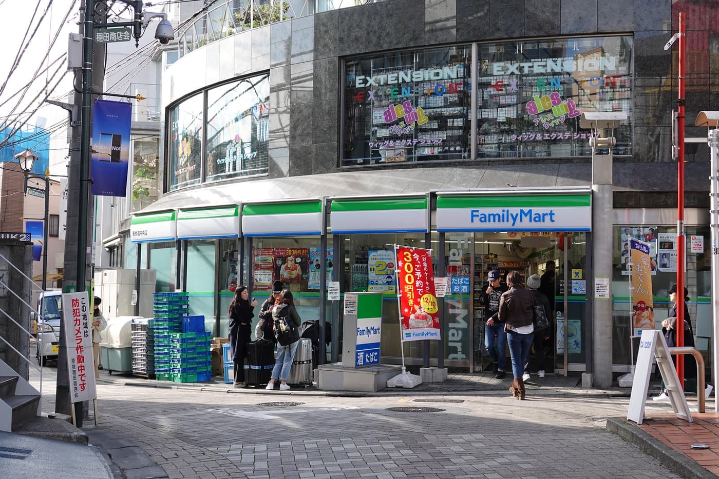 A FamilyMart convenience store on a street corner in Harajuku, Tokyo