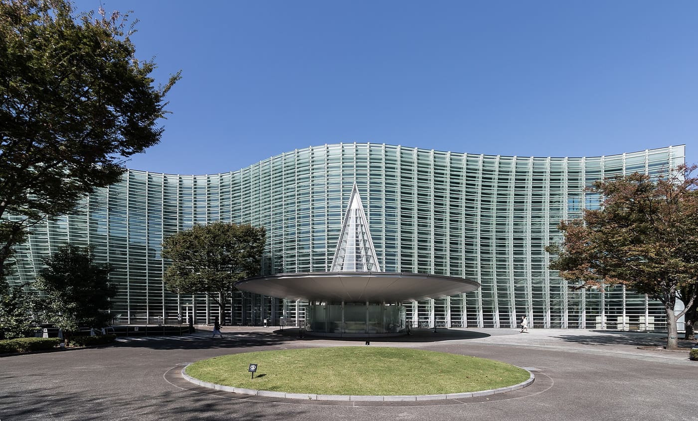The wave-shaped glass facade and entrance cone of the National Art Center Tokyo in Roppongi