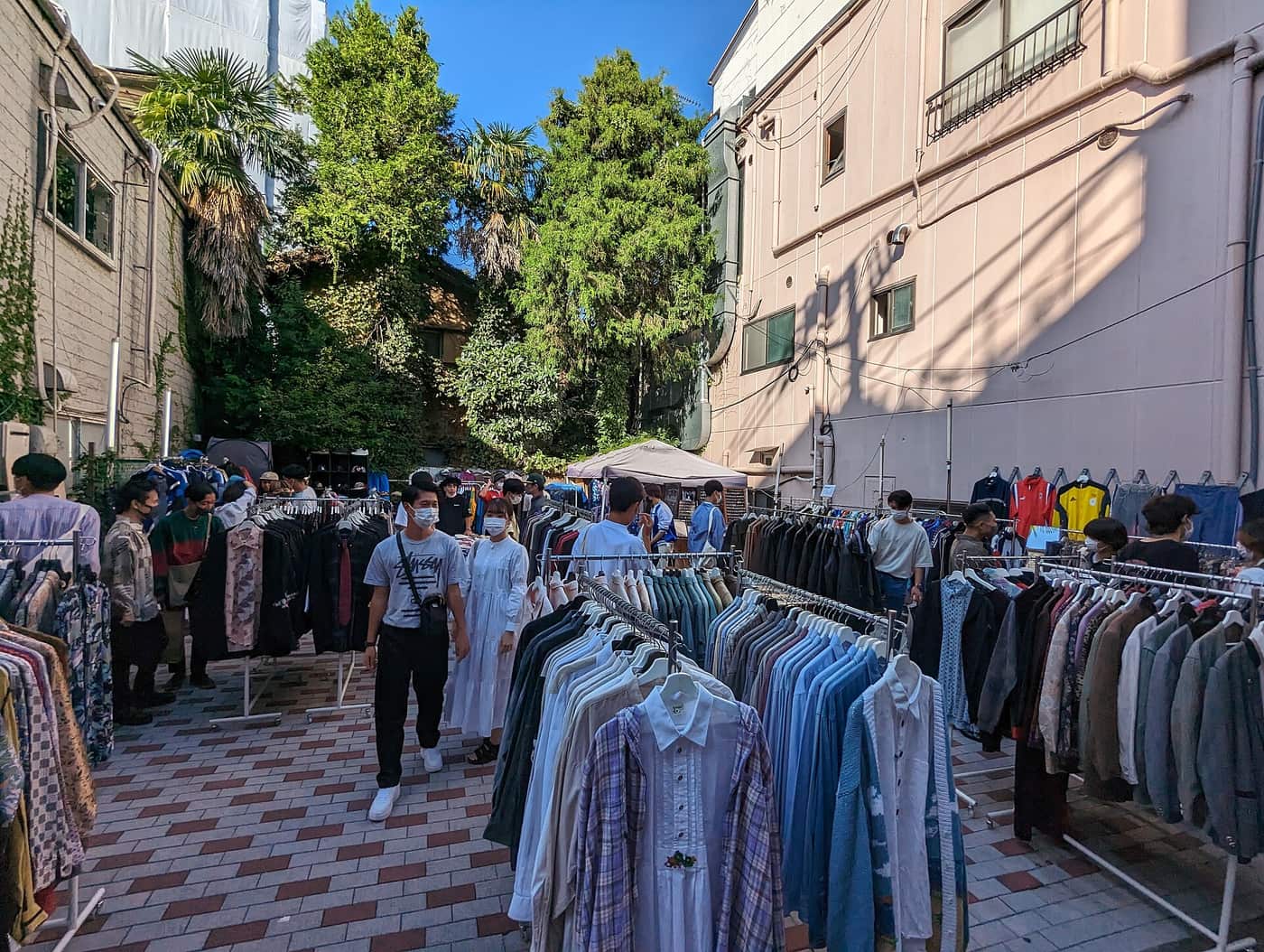 Racks of second-hand clothes outside vintage shops on a Shimokitazawa street