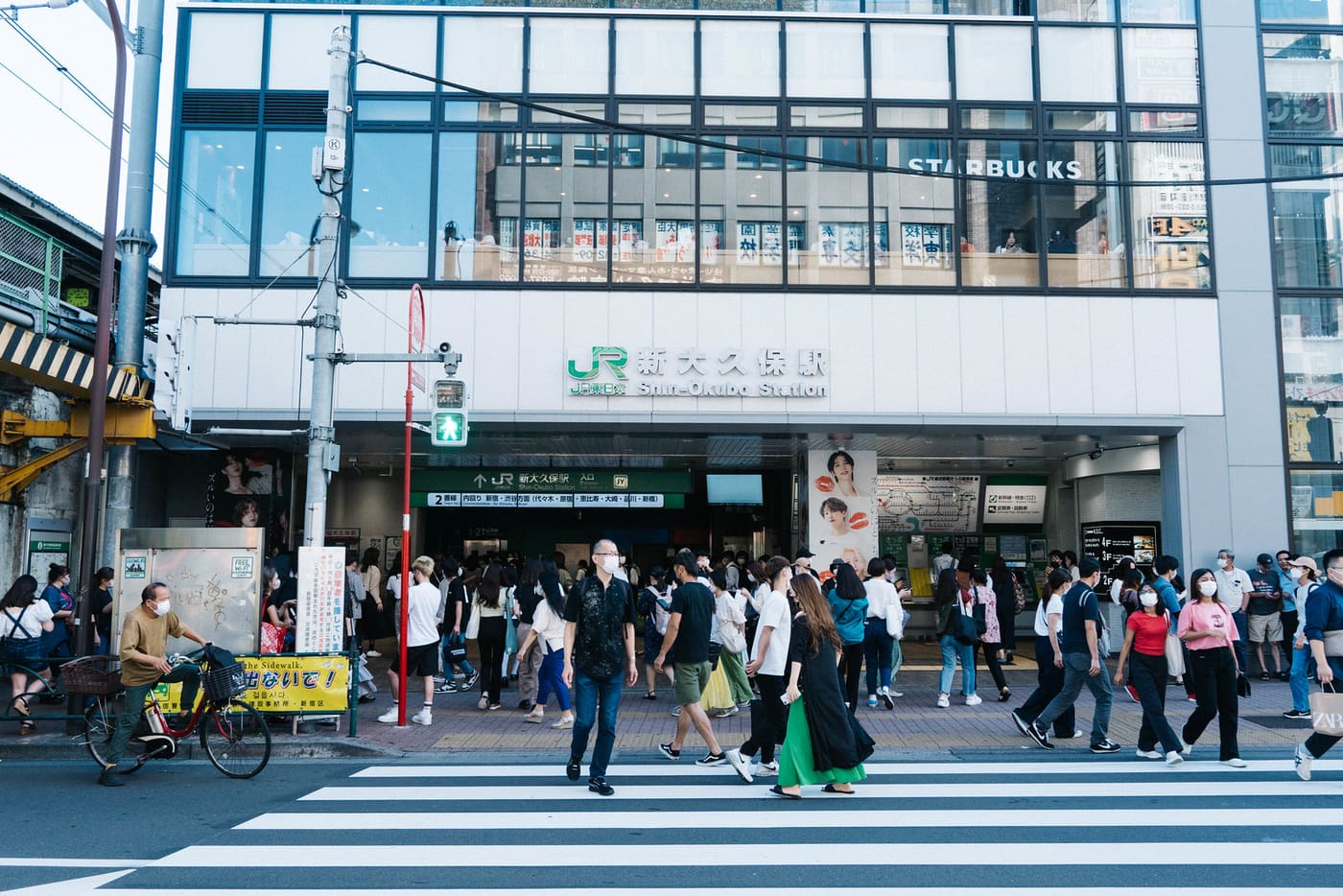 Crowds outside JR Shin-Okubo Station at the edge of Tokyo's Koreatown