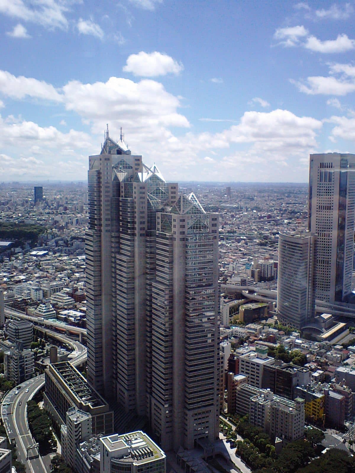 Shinjuku Park Tower, home of the Park Hyatt Tokyo, rising above the city