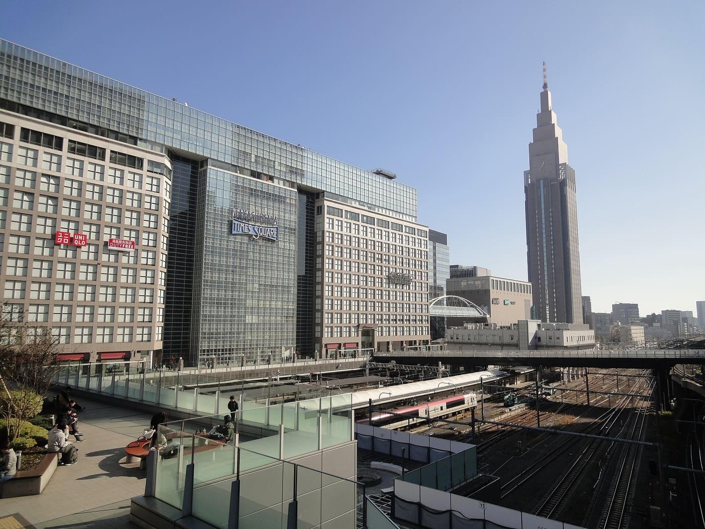 Takashimaya Times Square and the Docomo Tower above the tracks at Shinjuku south exit