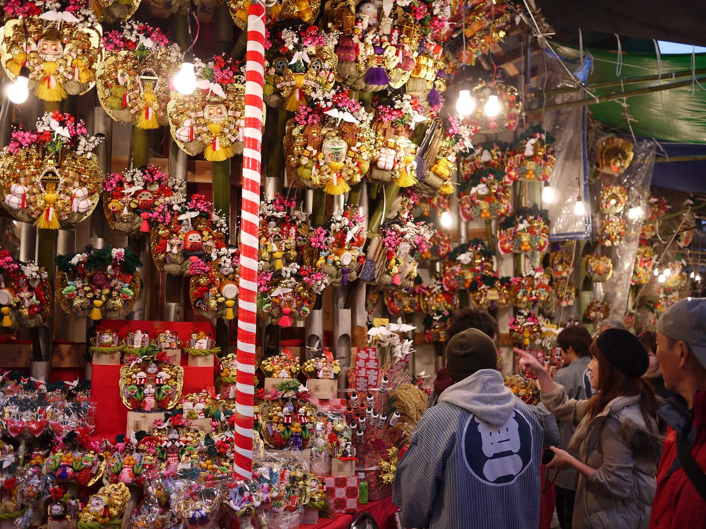 Kumade stalls packed with lucky rakes of every size at a Tori-no-ichi fair
