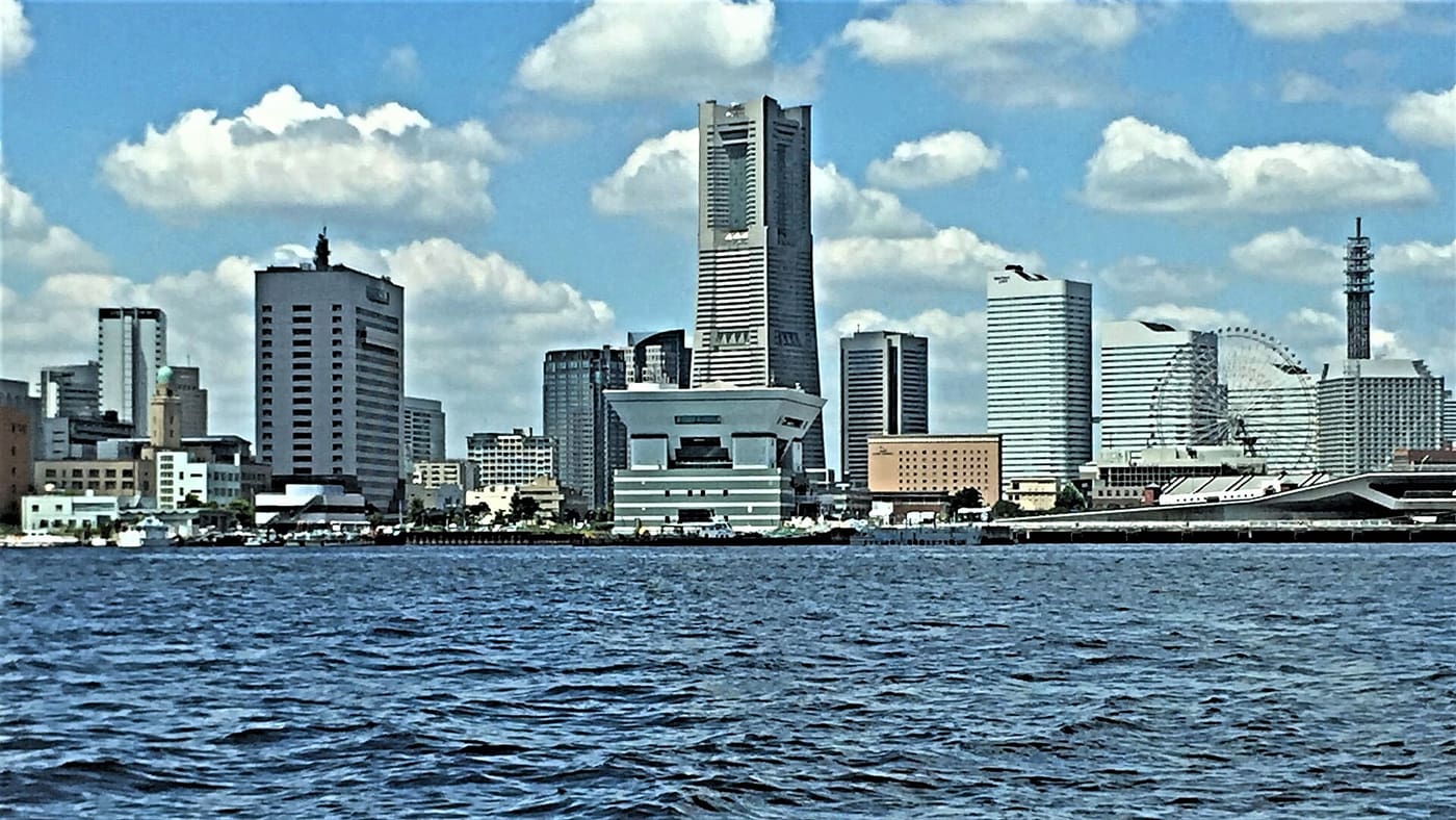 The Minato Mirai skyline of Yokohama seen from the water on a sunny day
