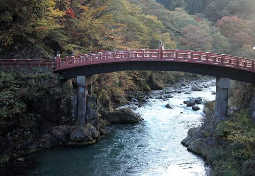 The red Shinkyo Bridge over the Daiya River in Nikko in autumn