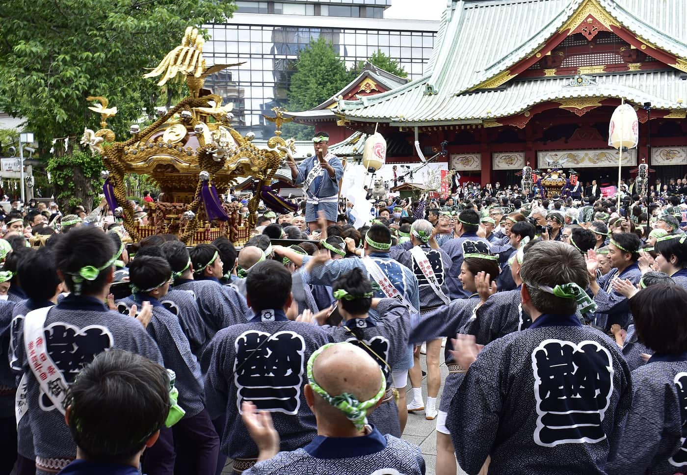 A mikoshi arriving in the crowded courtyard of Kanda Myojin during Kanda Matsuri