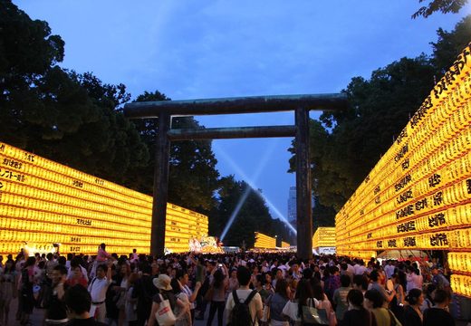 Walls of glowing paper lanterns lining the approach to Yasukuni Shrine during Mitama Matsuri